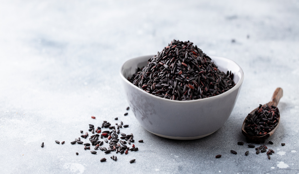 black rice in a bowl on a gray marble counter