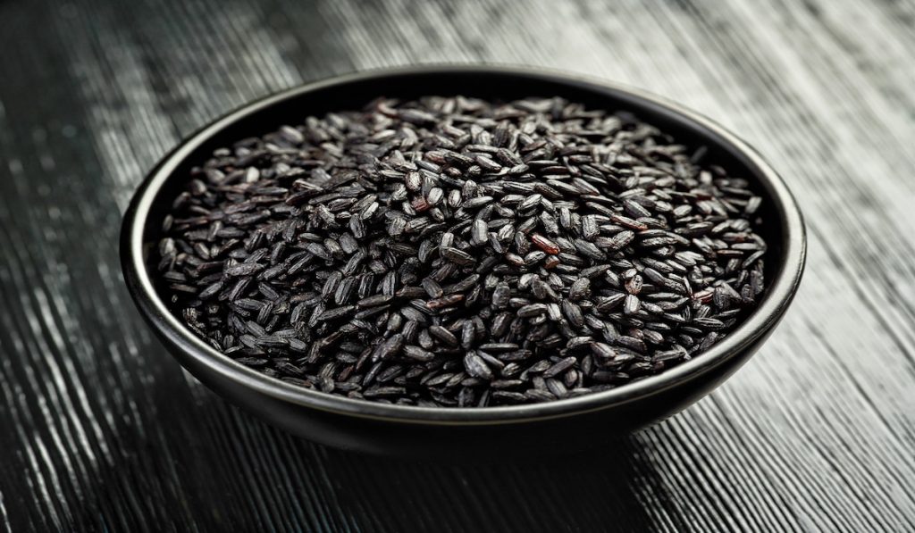 bowl of black rice on the table