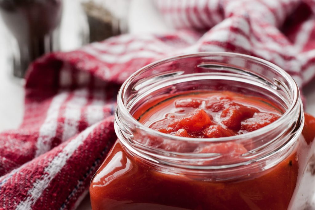 Pureed tomatoes in a glass jar