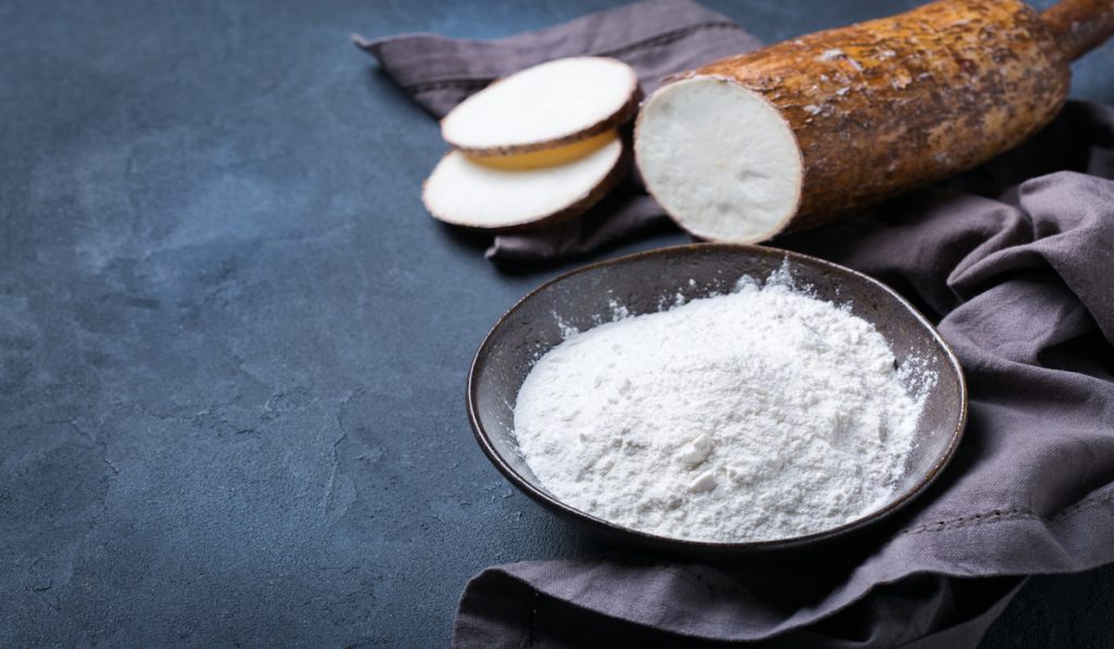 cassava flour in a wooden bowl 