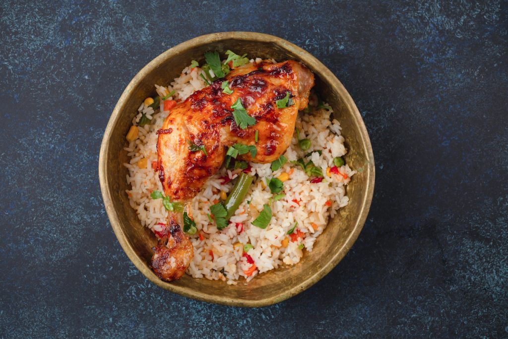 fried rice with grilled chicken in a bowl 