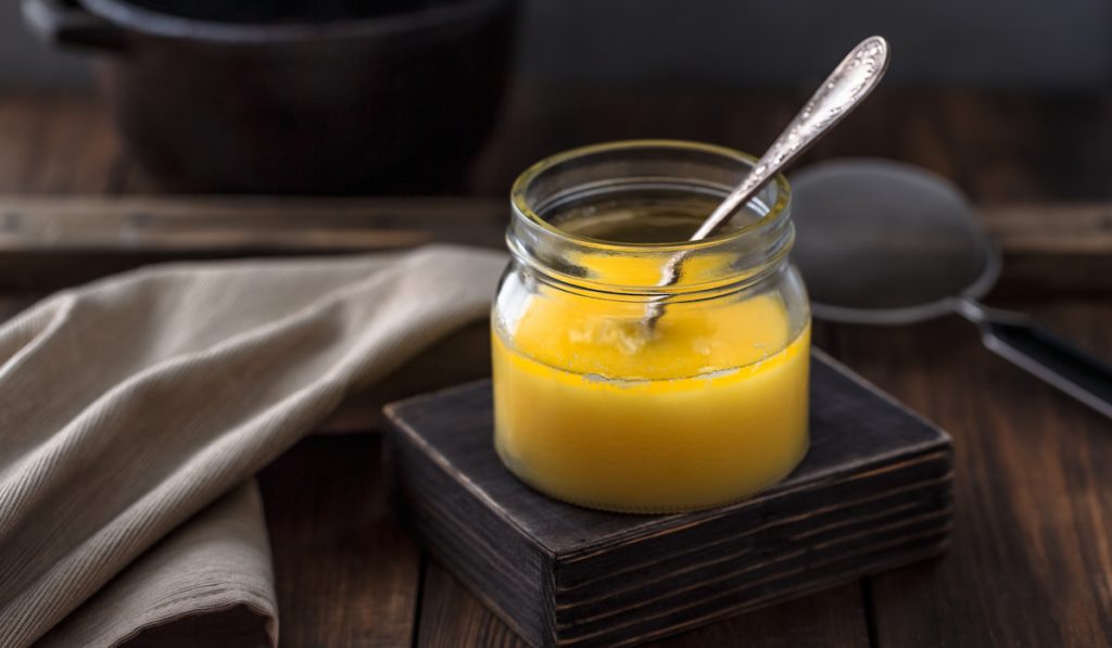 ghee in a jar and cloth on the table