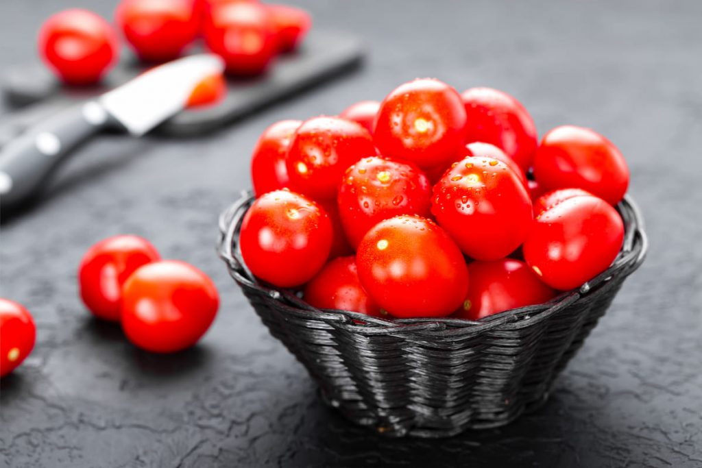 tomatoes fresh tomatoes in basket on table