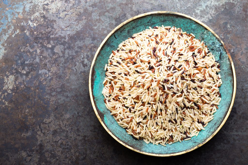 white brown and wild rice on a rustic bowl 