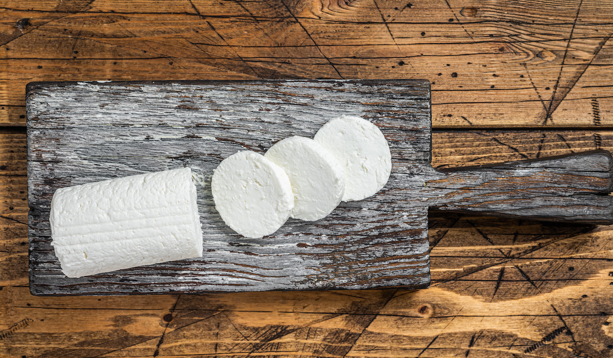 Sliced-Soft-Goat-cheese-on-a-cutting-board