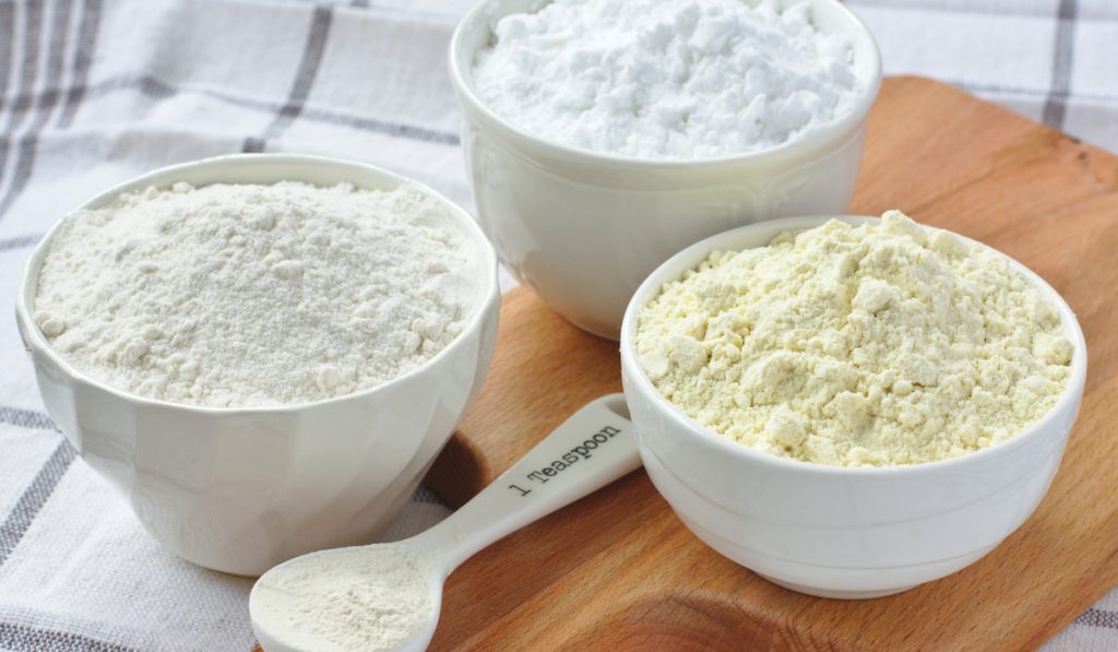 Xanthan-Gum-and-gluten-free-flour-in-white-bowls-on-wooden-board